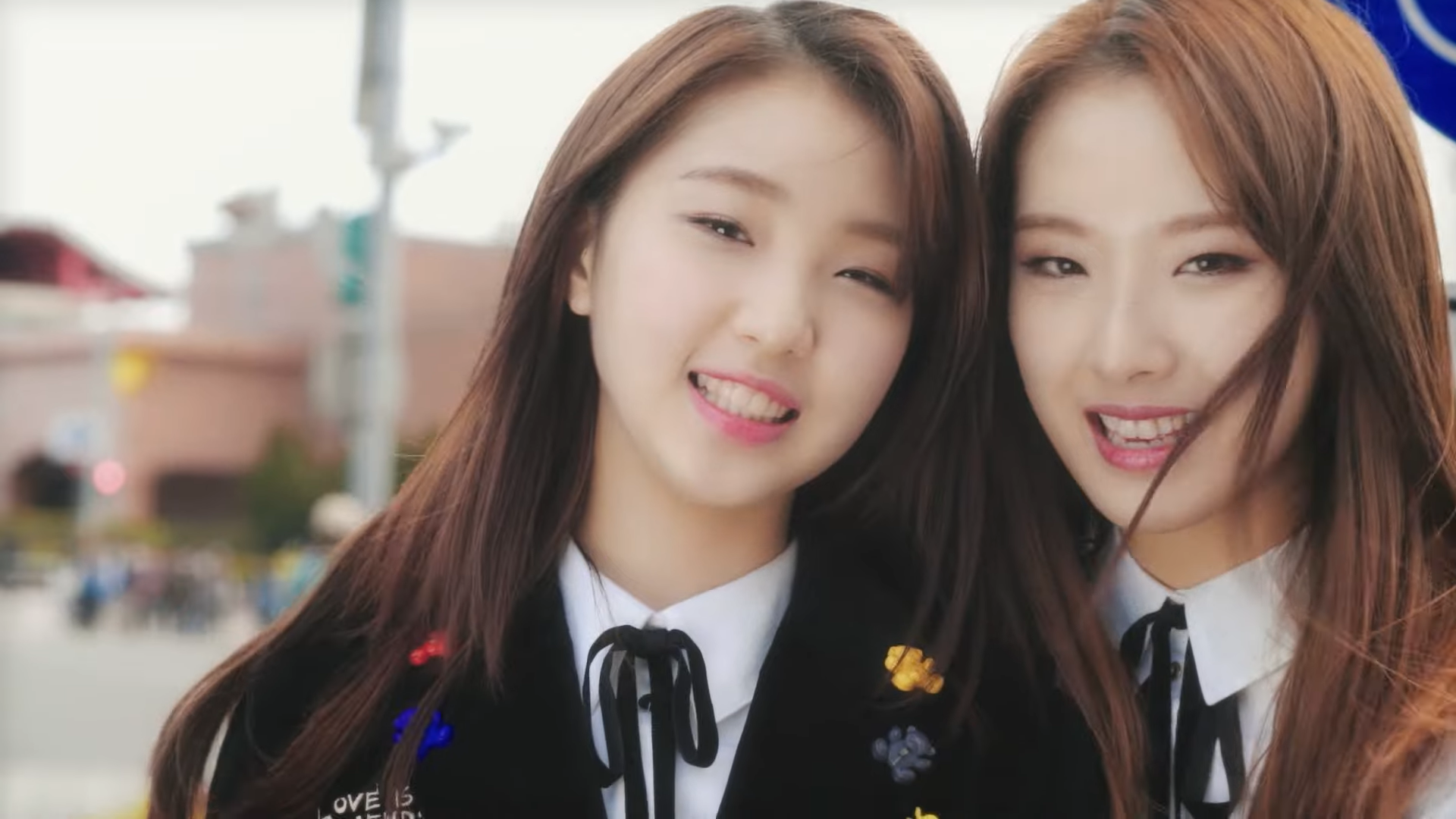 Yeojin and Haseul smiling together, from the 'My Melody' music video.